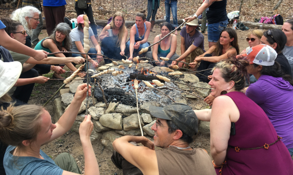Making biscuits over a campfire