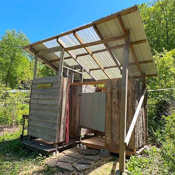 Earthaven campground shower - two stalls with propane-heated water
