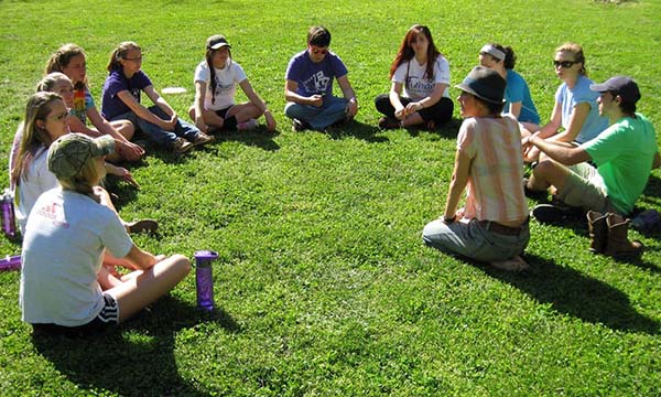 Class discussion on the Earthaven village green