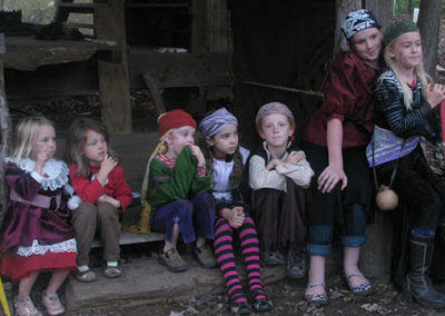 Earthaven kids preparing to perform a play about pirates