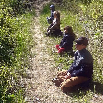 Kids meditating at Earthaven Ecovillage
