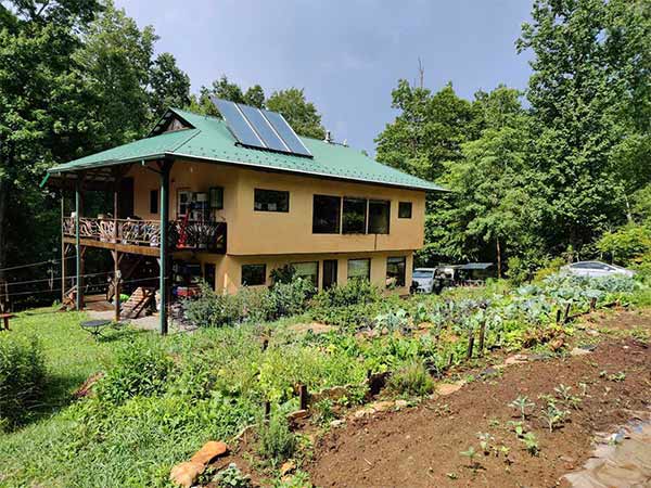 Green-built house with gardens and solar hot water